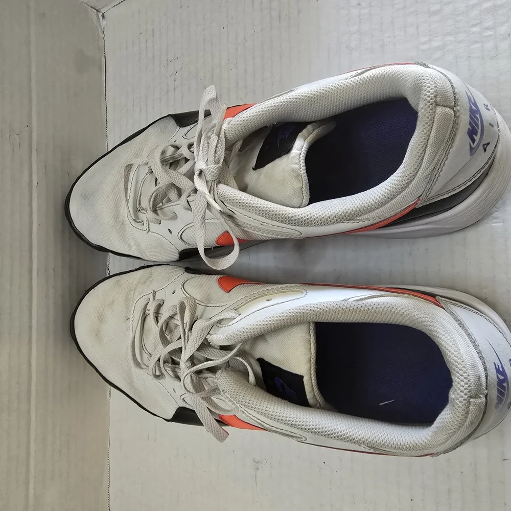 White and Black Athletic Shoes with Orange‎ Highlights
